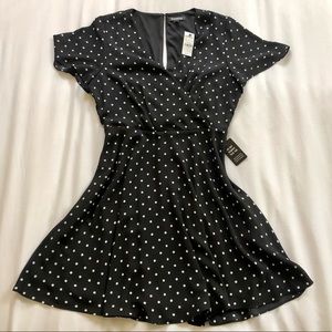 Black dress with white polka dots